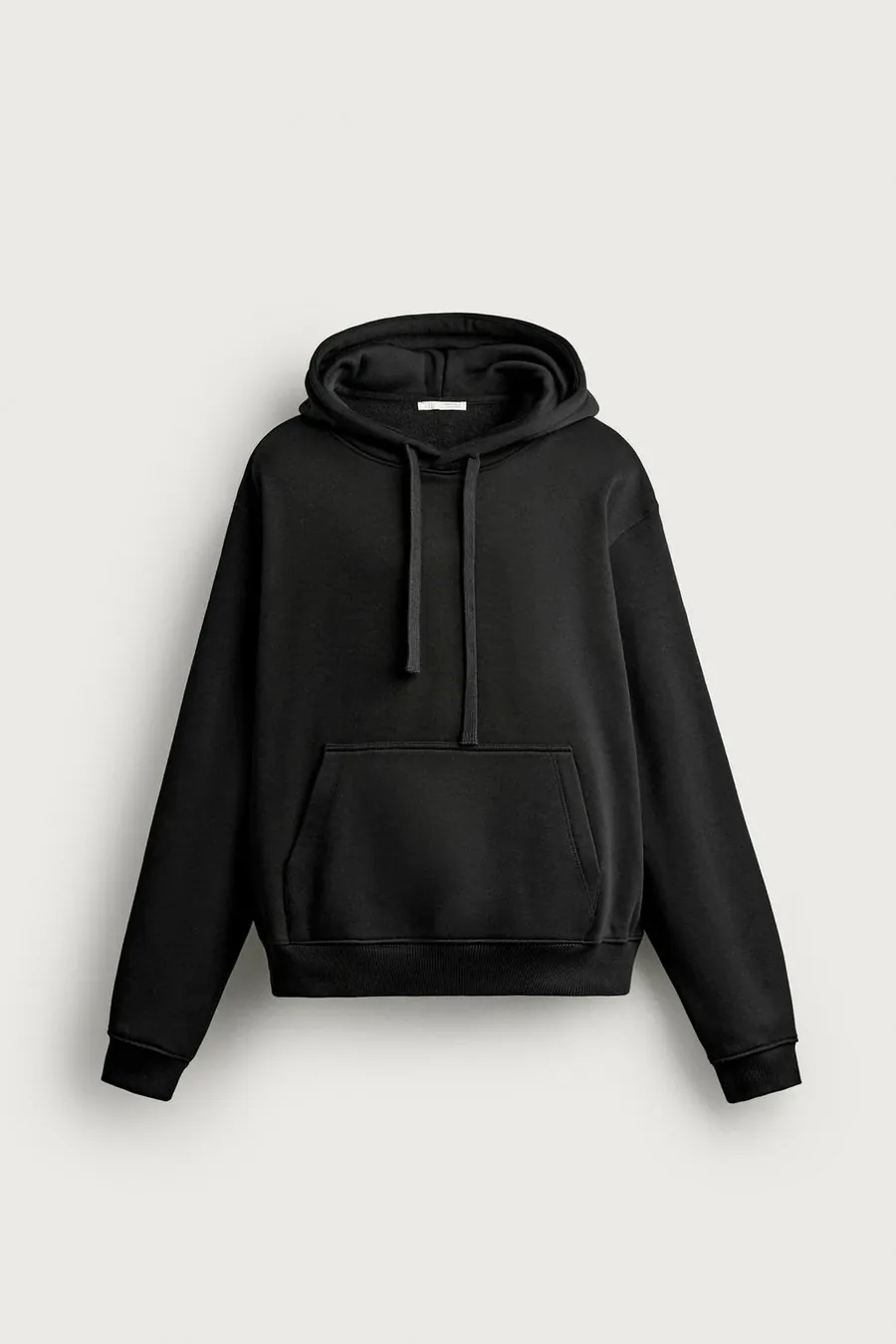 A plain black pullover hoodie with drawstrings and a kangaroo pocket