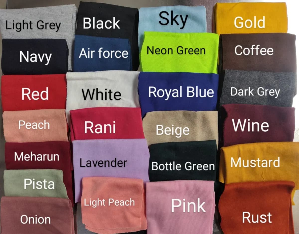 A fabric colour card with twenty-five labelled shades, from light grey and black to rust and pink